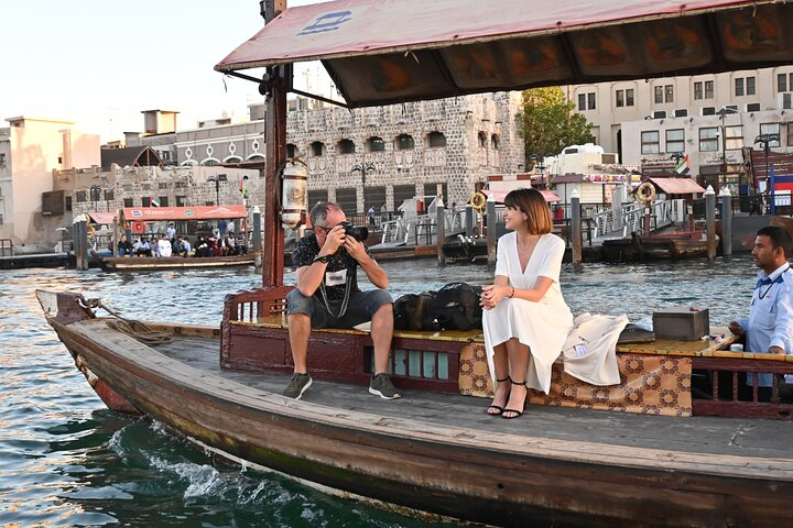 Experience the charm of Dubai's waterways aboard a traditional Abra soaking in the city’s mix of rich heritage and modern landmarks while enjoying a relaxing ride through its bustling culture.